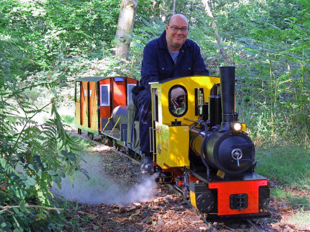 Andy driving the Feldbahn and it's new train.