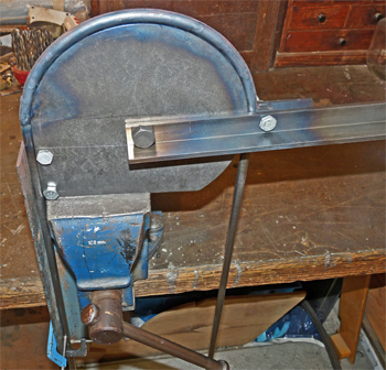 The completed handrail on the bending jig