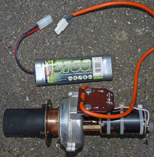 An electric steam raising blower and battery for a model steam locomotive