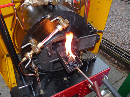 Lighting the fire of a Station Road Steam Stafford model stem loco